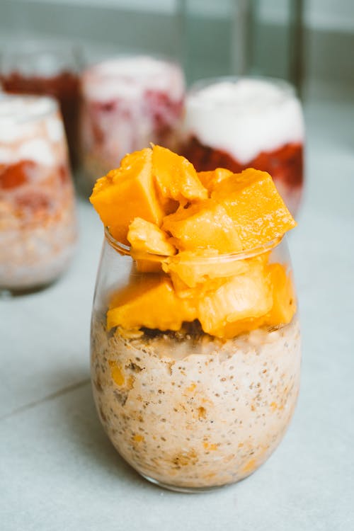 Free Sliced Fresh Mango in a Glass of Creamy Yoghurt Stock Photo