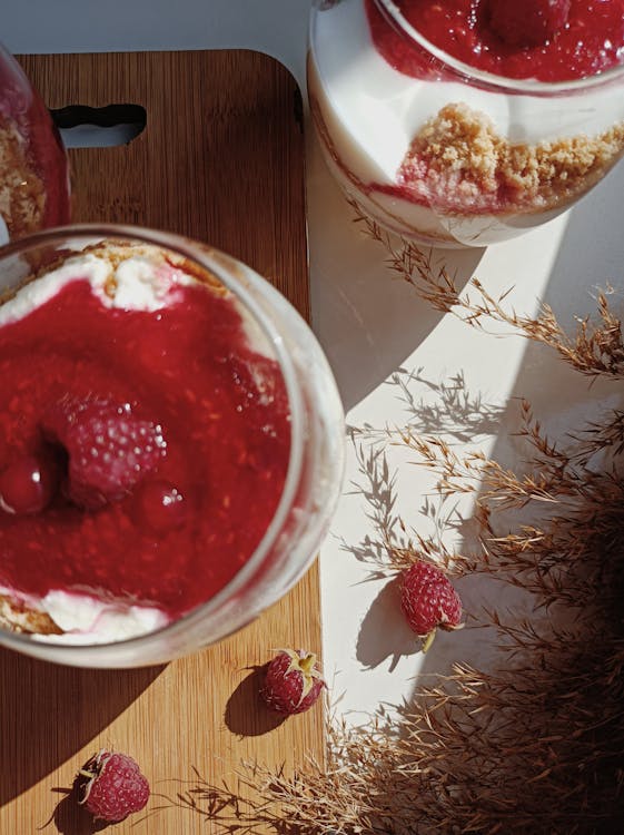 Free Dessert in Clear Glass with Raspberry on top Stock Photo