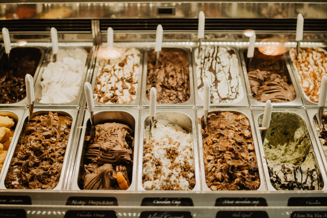 Free Gelato on Stainless Trays Inside a Display Freezer Stock Photo